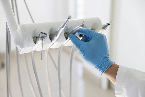 Professional Tooth Extraction technician working in Roscommon County County, MI